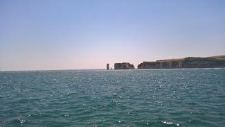 Seascape with cliffs in the distance